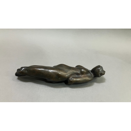 11 - British School mid 20th century, A bronze female nude figure, reclining, 22cm long