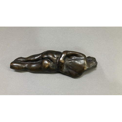 11 - British School mid 20th century, A bronze female nude figure, reclining, 22cm long