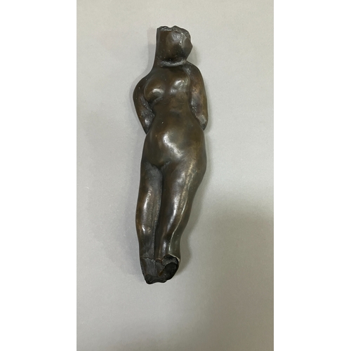 11 - British School mid 20th century, A bronze female nude figure, reclining, 22cm long