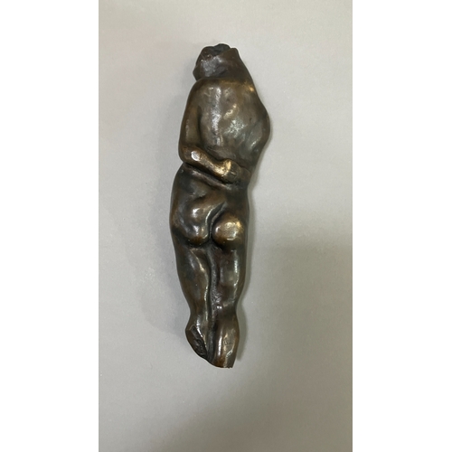 11 - British School mid 20th century, A bronze female nude figure, reclining, 22cm long