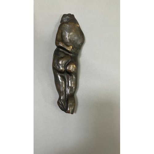 11 - British School mid 20th century, A bronze female nude figure, reclining, 22cm long