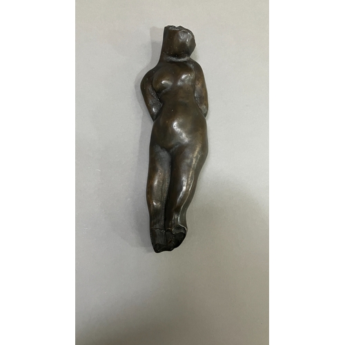 11 - British School mid 20th century, A bronze female nude figure, reclining, 22cm long