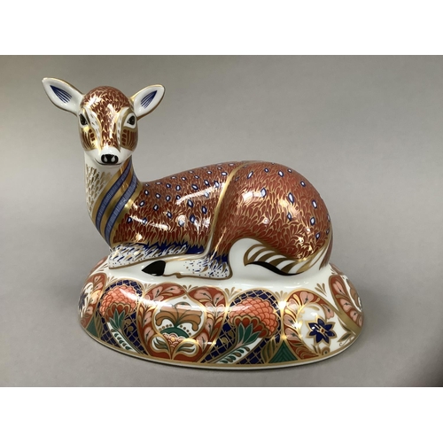 1 - A Royal Crown Derby figure of a deer, recumbent, on an oval base, designed exclusively for the Royal... 