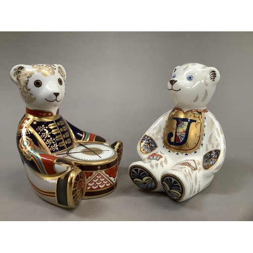 12 - A Royal Crown Derby alphabet bear, gold button, together with drummer bear, 10.5cm and 10cm high