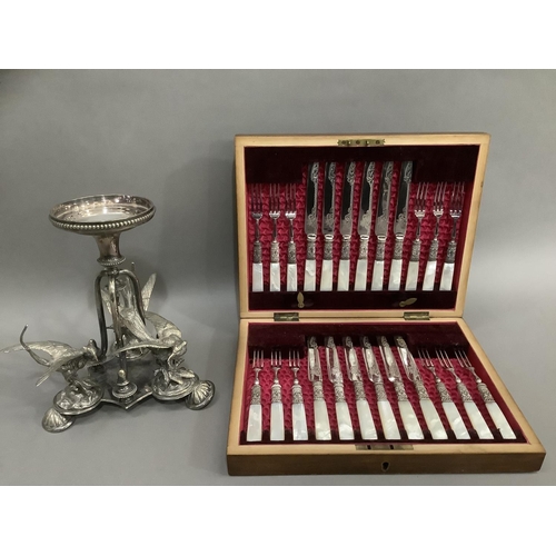 318 - A late Victorian mahogany canteen of twelve mother of pearl handled silver plated dessert knives and... 