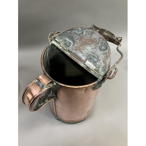 345 - A 19th century copper watering can 35cm high together with a glass dome having metal base and handle... 