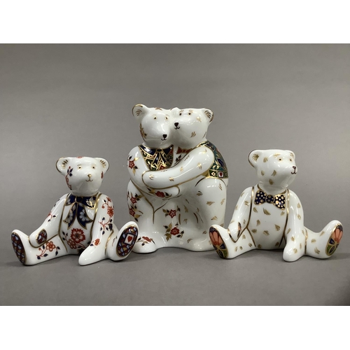 32 - A Royal Crown Derby model of two bears hugging together with two seated bears, 9cm and 6.5cm