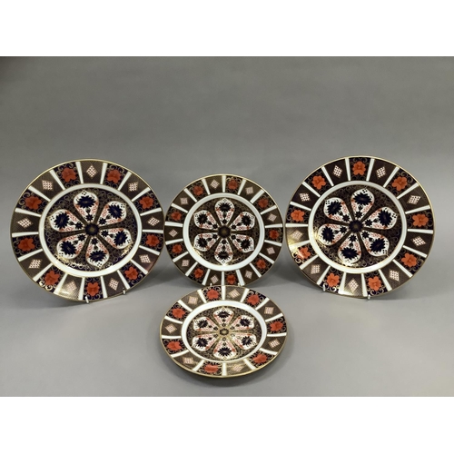 36 - Two Royal Crown Derby Old Imari pattern dinner plates 1128, 26.5cm together with two further plates ... 