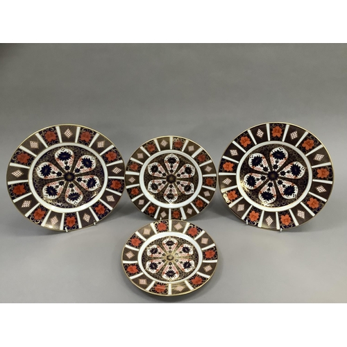 36 - Two Royal Crown Derby Old Imari pattern dinner plates 1128, 26.5cm together with two further plates ... 