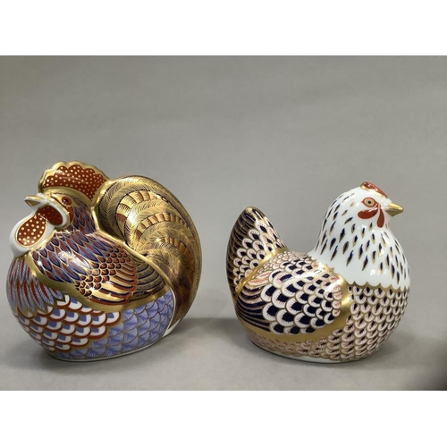 4 - A Royal Crown Derby cockerel and hen, gold buttons (2) 9.5cm and 8cm high