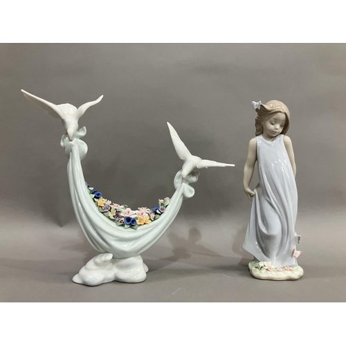 41 - A Lladro figure group of two doves carrying a swag of flowers, no.6579 and Girl with butterflies no.... 