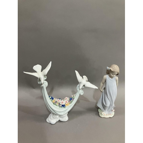 41 - A Lladro figure group of two doves carrying a swag of flowers, no.6579 and Girl with butterflies no.... 