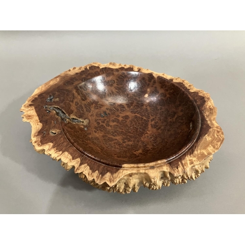 47 - A turned walnut fruitbowl, the exterior formed as bark with a smooth interior