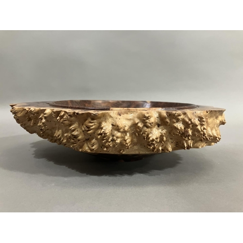 47 - A turned walnut fruitbowl, the exterior formed as bark with a smooth interior