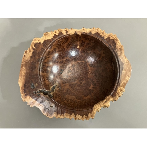 47 - A turned walnut fruitbowl, the exterior formed as bark with a smooth interior