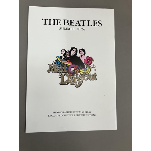 48 - A Coalport Characters Beatles Yellow Submarine plaque, together with a Mad Day Out photoshoot book b... 