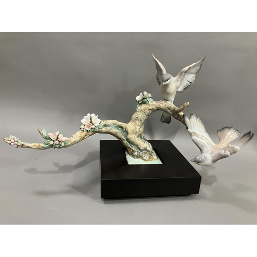 50 - A Lladro figure group, Forest Song, Utopia series depicting birds on a two limbed branch with cluste... 