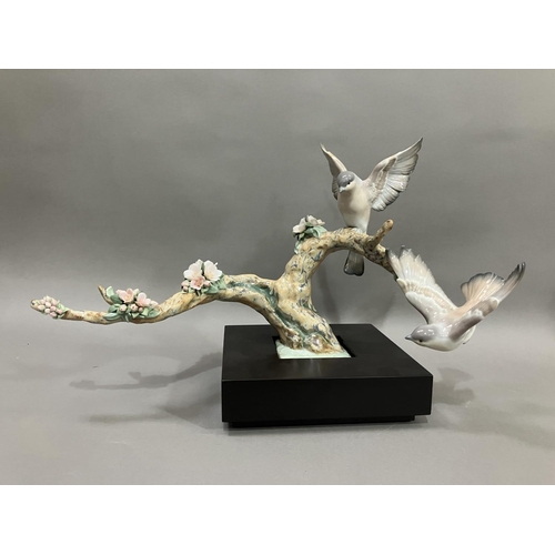 50 - A Lladro figure group, Forest Song, Utopia series depicting birds on a two limbed branch with cluste... 