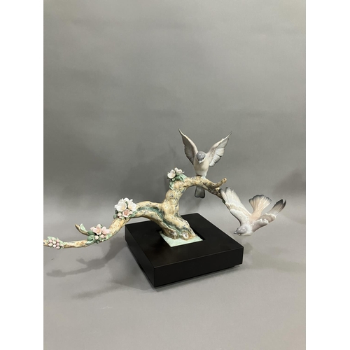 50 - A Lladro figure group, Forest Song, Utopia series depicting birds on a two limbed branch with cluste... 