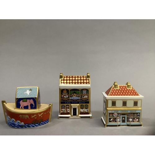 7 - A Royal Crown Derby model 'The China Shop' 8.5cm high, 'The Toy Box' 10cm high and 'Miller's Ark' 8c... 