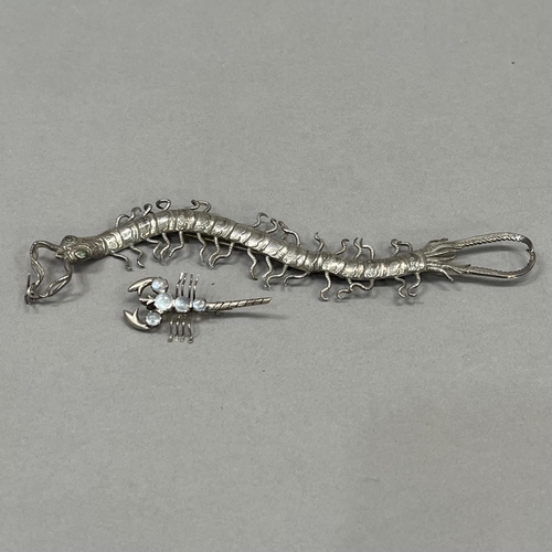 457 - An early to mid 20th century centipede brooch (at fault) in .800 silver in full relief, set to the e... 