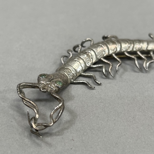 457 - An early to mid 20th century centipede brooch (at fault) in .800 silver in full relief, set to the e... 