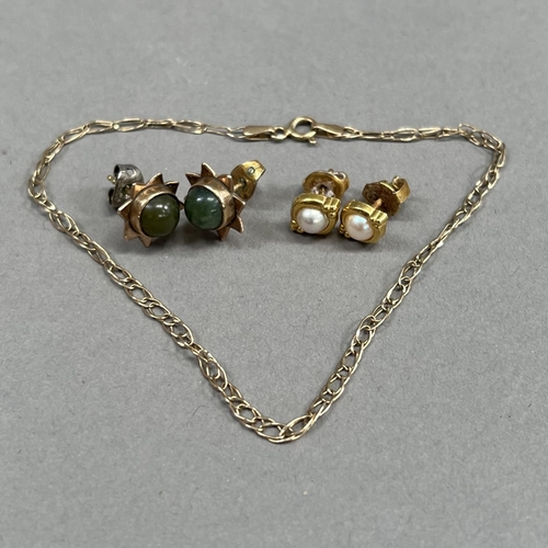 467 - A pair of early to mid 20th century jade ear studs in 9ct gold each set with a circular nephrite cab... 