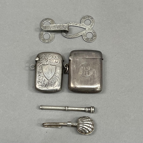 468 - A silver napkin holder London 1999, together with an Edward VII silver composite cloak hook, two Edw... 