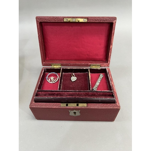 417 - AN early 20th century jewellery case covered in faux red leather with tiered red velvet lining toget... 