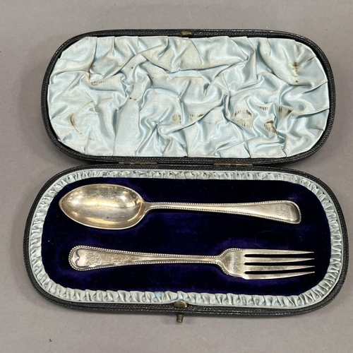 394 - A boxed pair of Victorian spoon and fork, London 1892 for Robert Stebbings in beaded Hanoverian patt... 