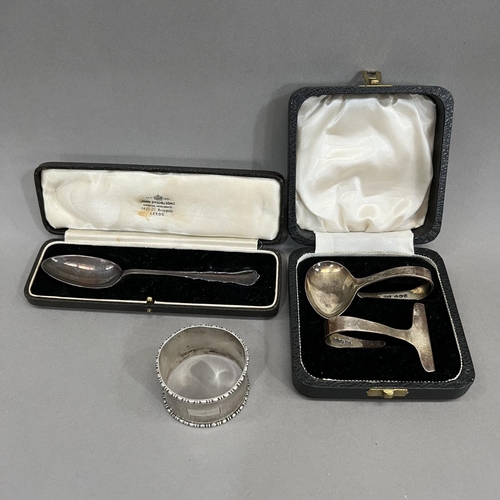 392 - A boxed composite set of Queen Elizabeth II silver spoon and pusher Sheffield 1955 for Viners togeth... 