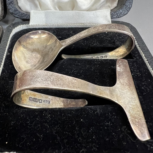 392 - A boxed composite set of Queen Elizabeth II silver spoon and pusher Sheffield 1955 for Viners togeth... 