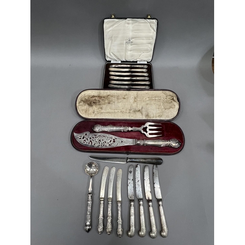 370 - A boxed set of silver handled cake knives together with several other items of silver handled cutler... 