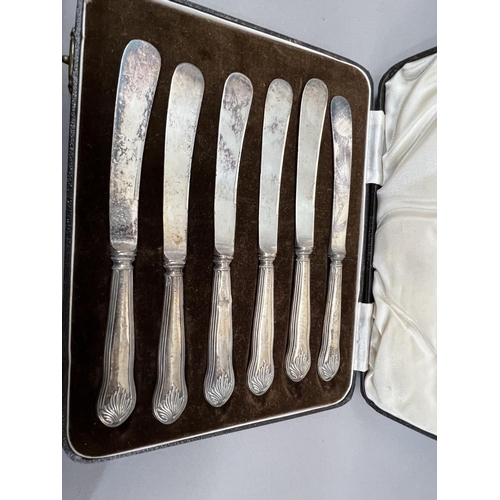 370 - A boxed set of silver handled cake knives together with several other items of silver handled cutler... 