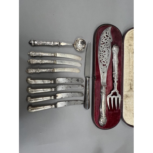 370 - A boxed set of silver handled cake knives together with several other items of silver handled cutler... 