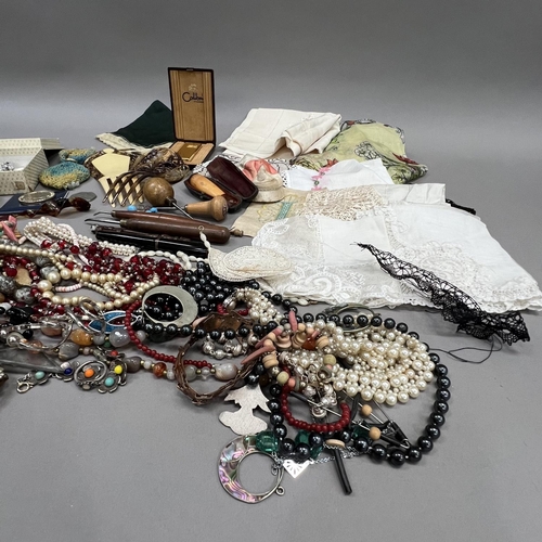 418 - A collection of mid 20th century costume jewellery and early 20th century textiles including necklac... 