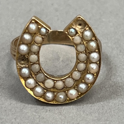 444 - An early 20th century coral and seed pearl set horse shoe ring in 9ct gold (at fault), two pearls mi... 