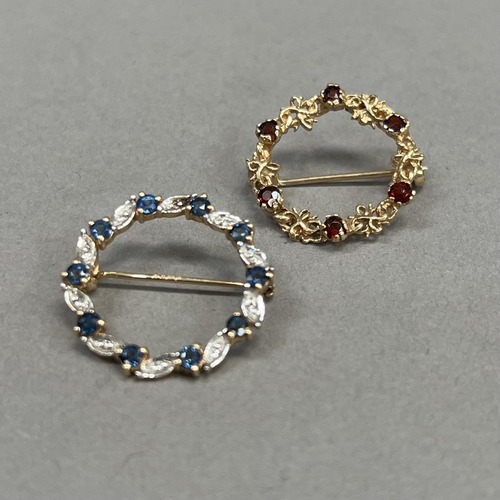 435 - A sapphire and diamond wreath brooch in 9ct gold claw and grain set with small eight cut diamonds an... 