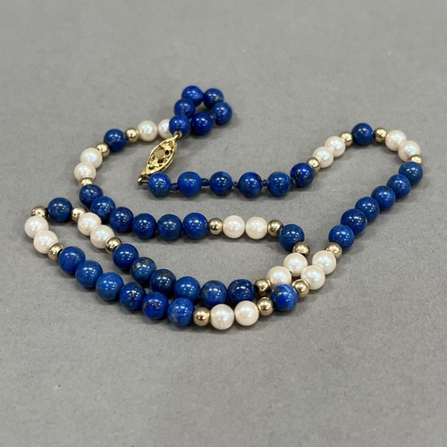 463 - A necklace of spherical 6mm diameter Lapis Lazuli beads, 5.5mm diameter cultured pearls and 4mm diam... 