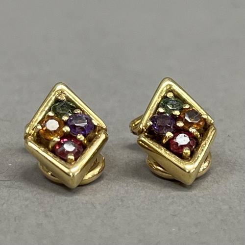 449 - A pair of cluster ear clips, each claw set with circular faceted amethyst, garnet, citrean and perid... 