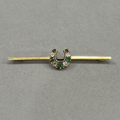 429 - A Victorian Demantoid garnet and diamond horseshoe stock pin in 15ct gold, on a 9ct rose gold pin, a... 