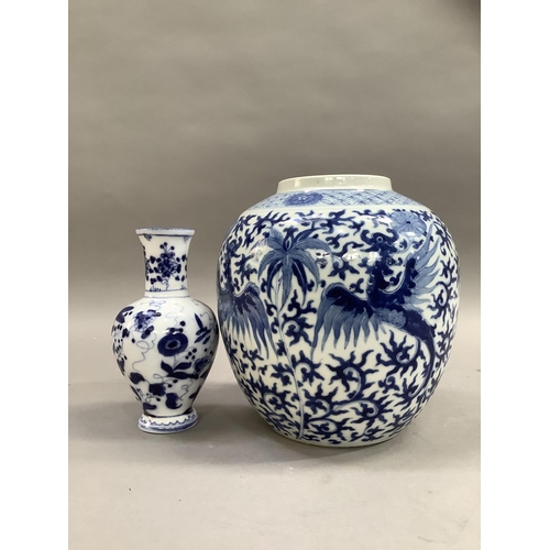 79 - A Chinese ginger jar of ovoid form painted in underglaze blue with opposing pairs of phoenix below a... 