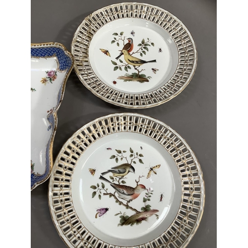 80 - A pair of 19th century Meissen porcelain plates, polychrome painted with birds perched on leafy bran... 