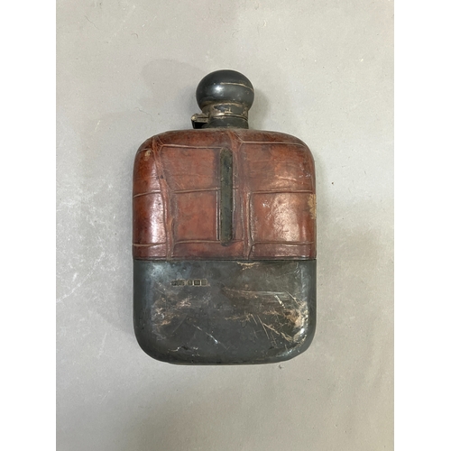 391 - A George V glass hip flask with crocodile leather wrapped top, silver cup and bayonet cap, Sheffield... 