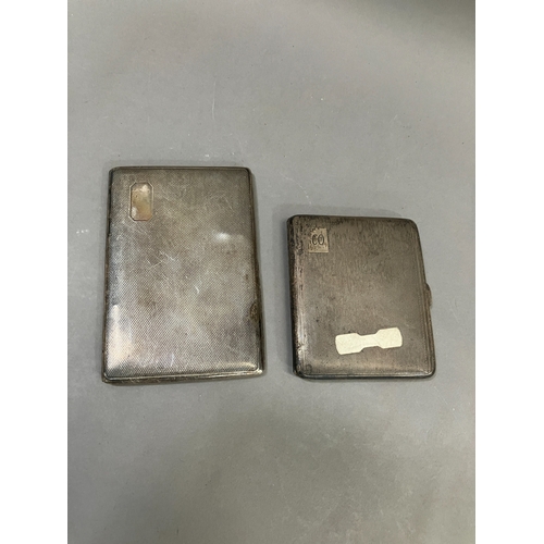 393 - Two early to mid 20th century silver cigarette cases, total approximate weight 10oz