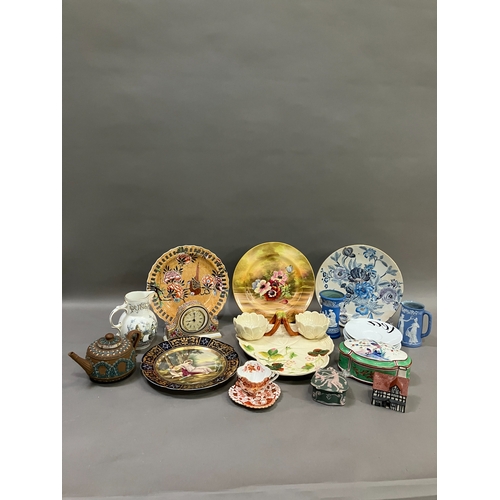 305 - A collection of ceramics comprising a moulded hors d'oeuvres tray formed as a basket with lilies, a ... 