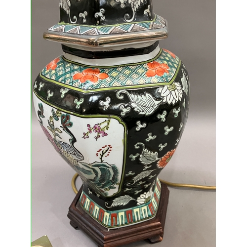 326 - A Chinese famille noir vase and cover converted to a table lamp having peacock filled cartouches, 35... 