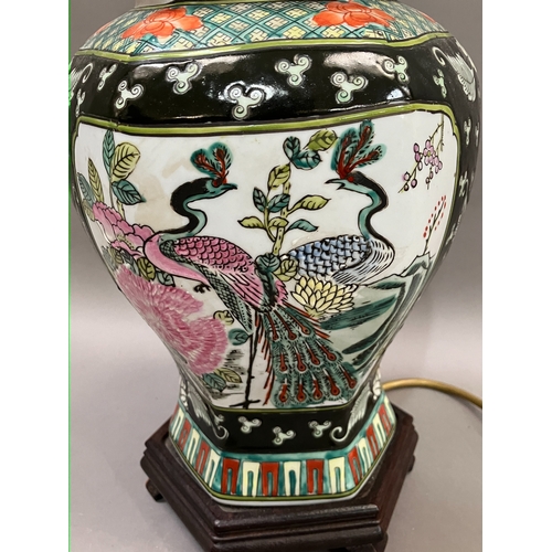 326 - A Chinese famille noir vase and cover converted to a table lamp having peacock filled cartouches, 35... 