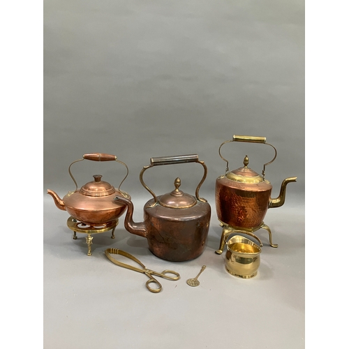 100 - Three copper and brass kettles, two brass trivets together with further brass ware