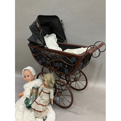 352 - Two dolls with porcelain heads and limbs, jointed bodies and together with a modern realistic doll i... 